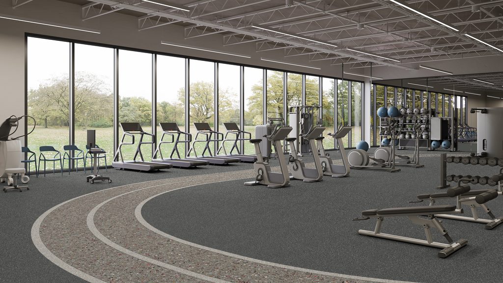 Indoor gym with row of treadmills facing large windows showing trees outside plus weight racks and strength machines along the wall