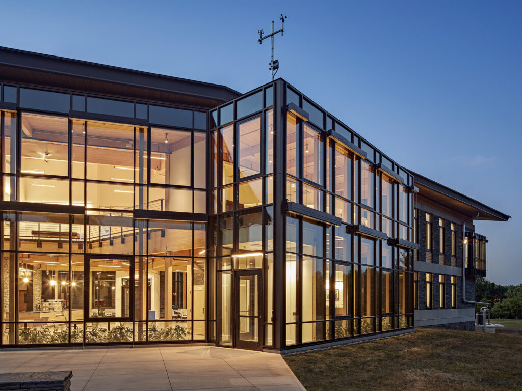 Robert bensonkerncenter19 | trim tab Contemporary glass fronted office building at dusk with warm interior lighting visible through large windows